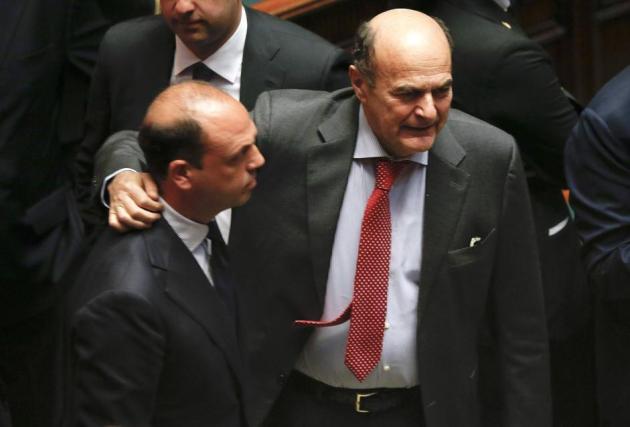 PD leader Bersani embraces PDL secretary Alfano during the presidential election in the lower house of the parliament in Rome
